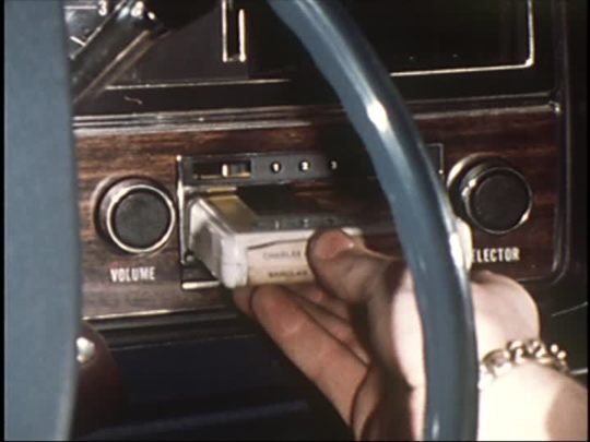 205817424-8-track-tape-audiocassettes-fade-in-car-radio